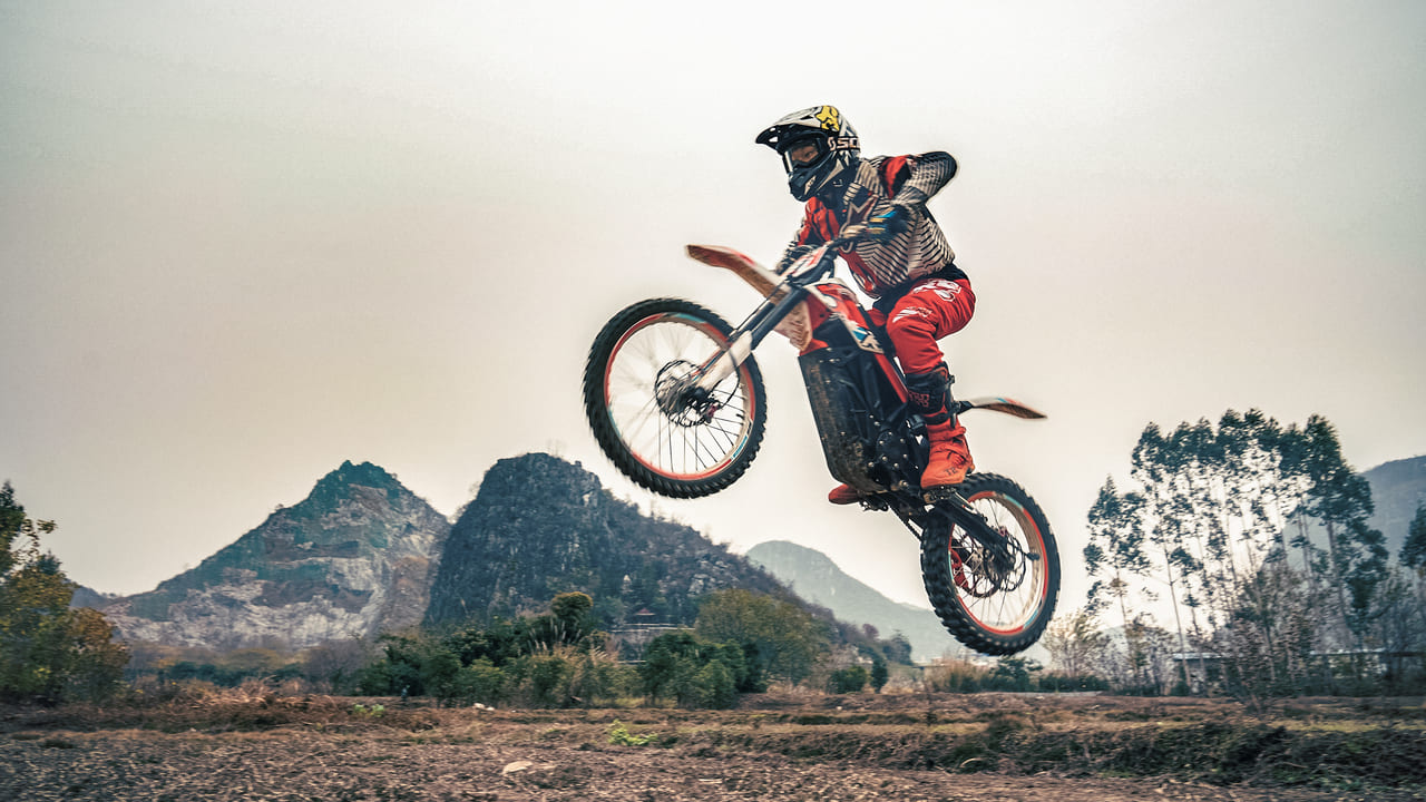 Electric dirt bike jump to the air