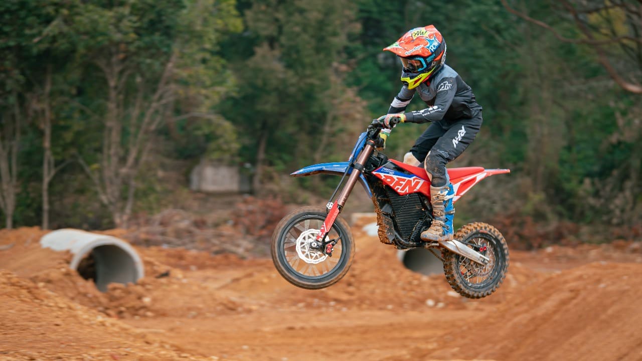 Youth dirt bike rider with full gear