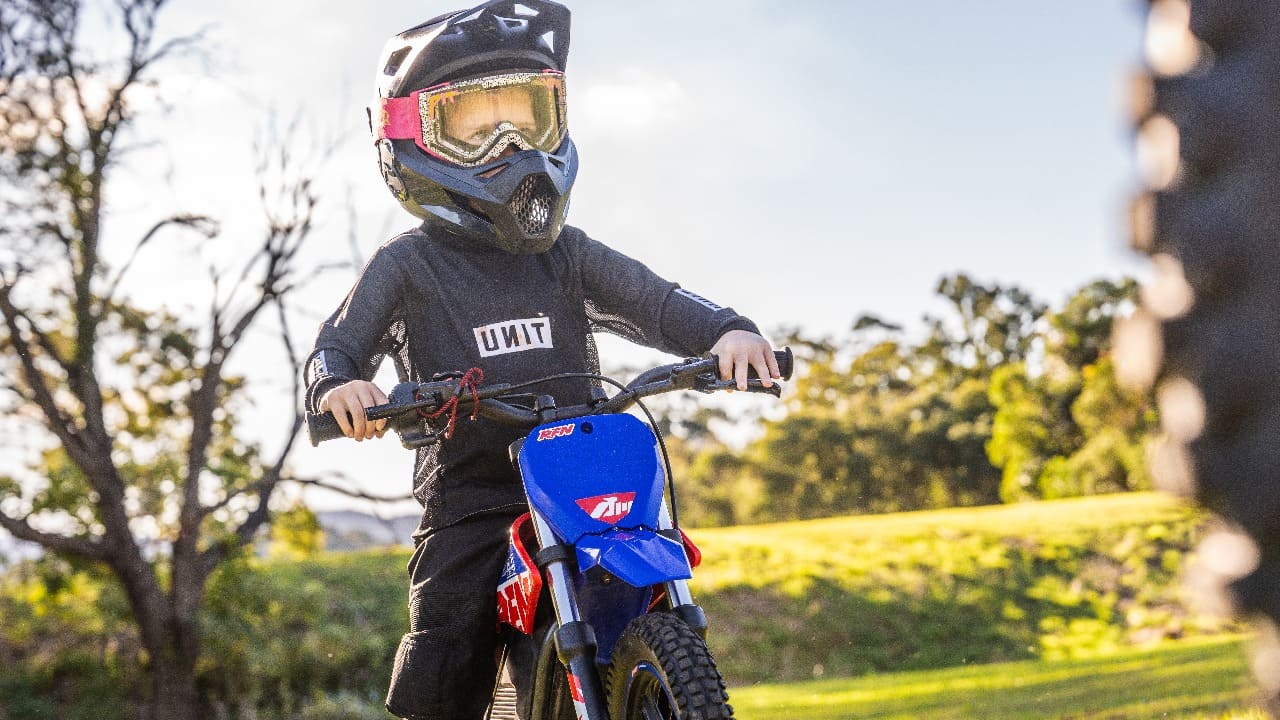 kid riding a 50cc dirt bike